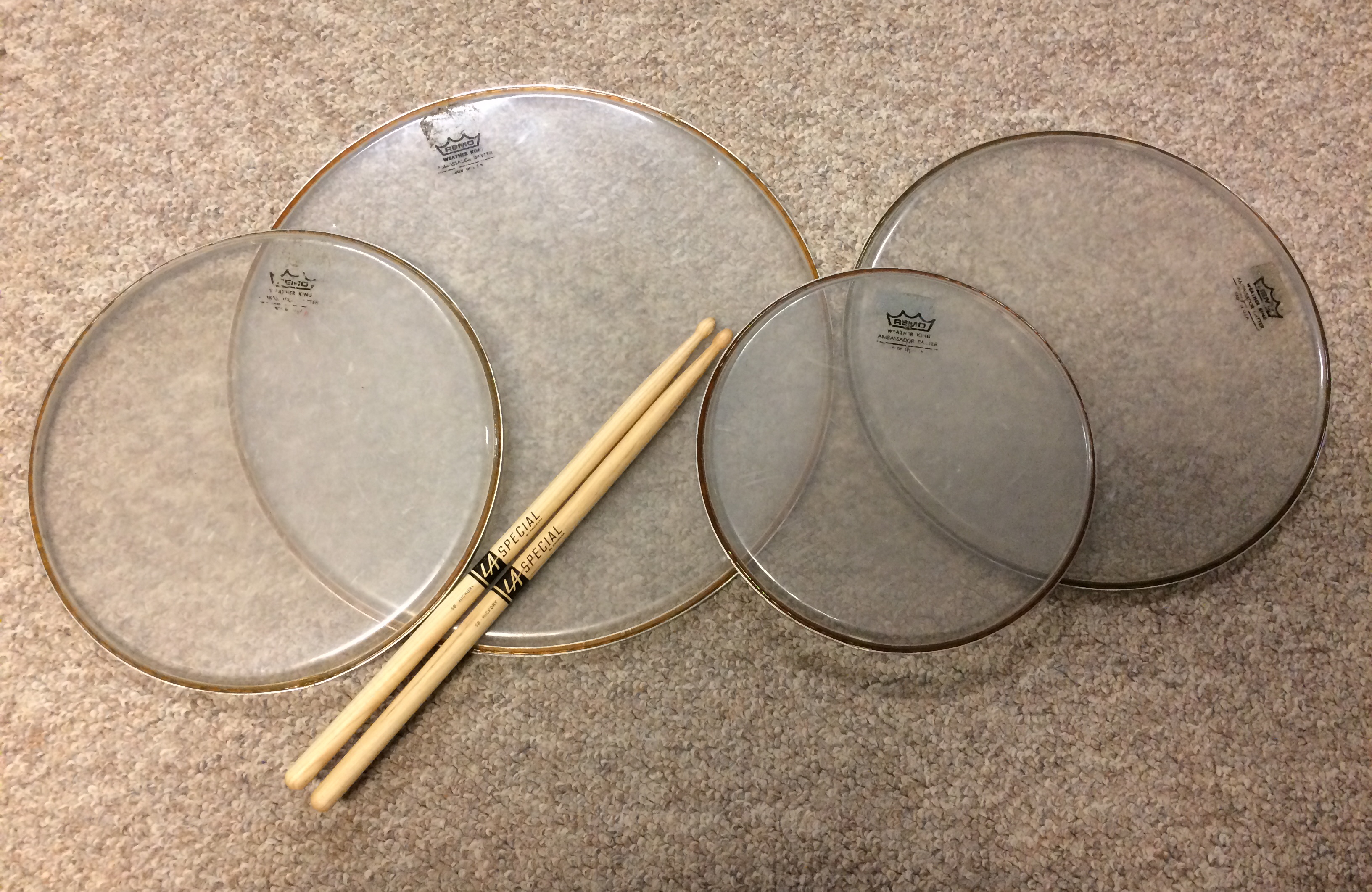 Drum heads and sticks